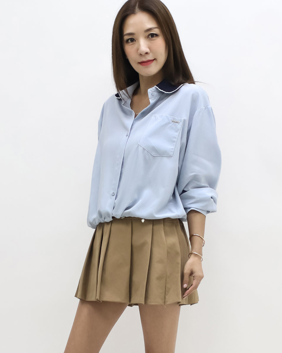 blue shirt w/ navy knitted collar