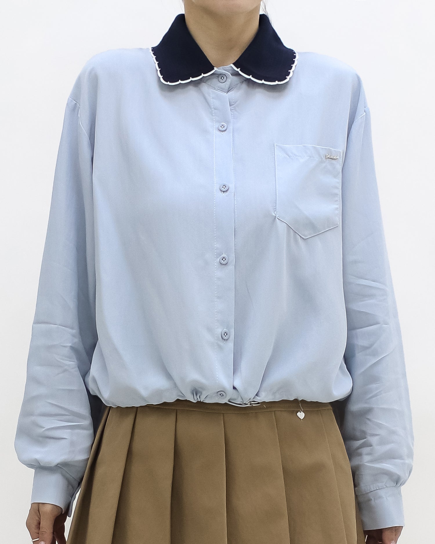 blue shirt w/ navy knitted collar