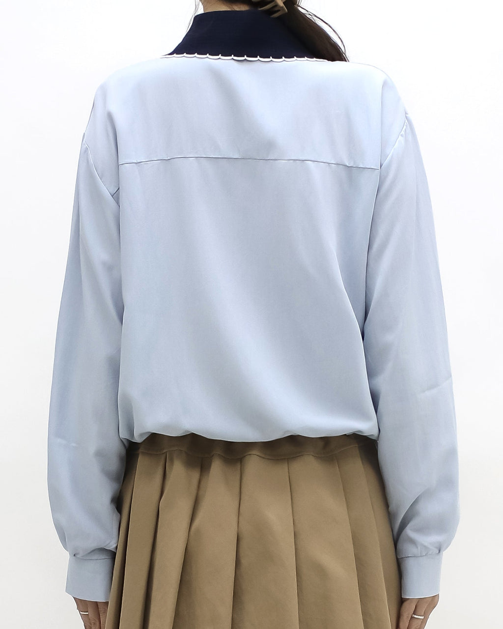 blue shirt w/ navy knitted collar