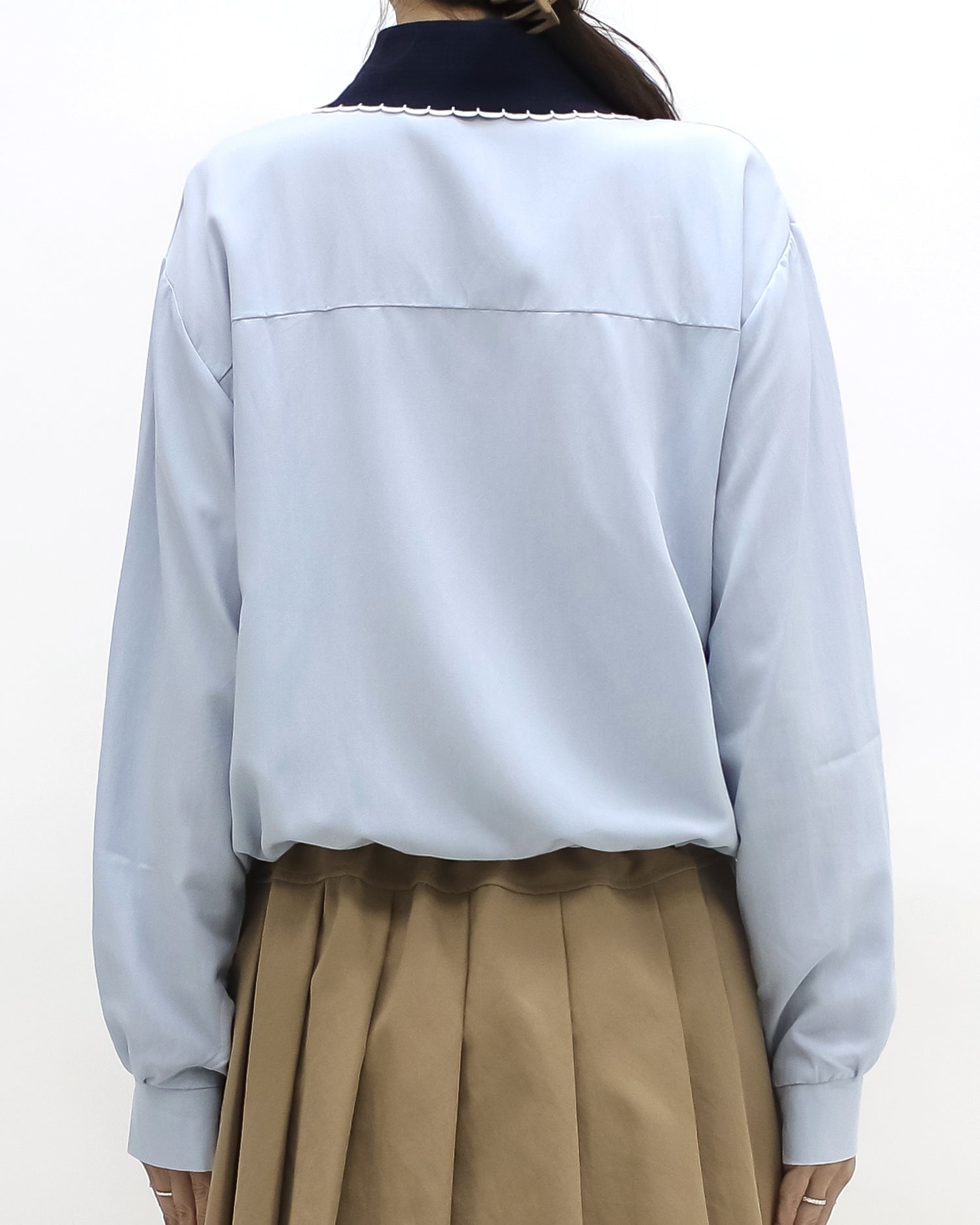 blue shirt w/ navy knitted collar