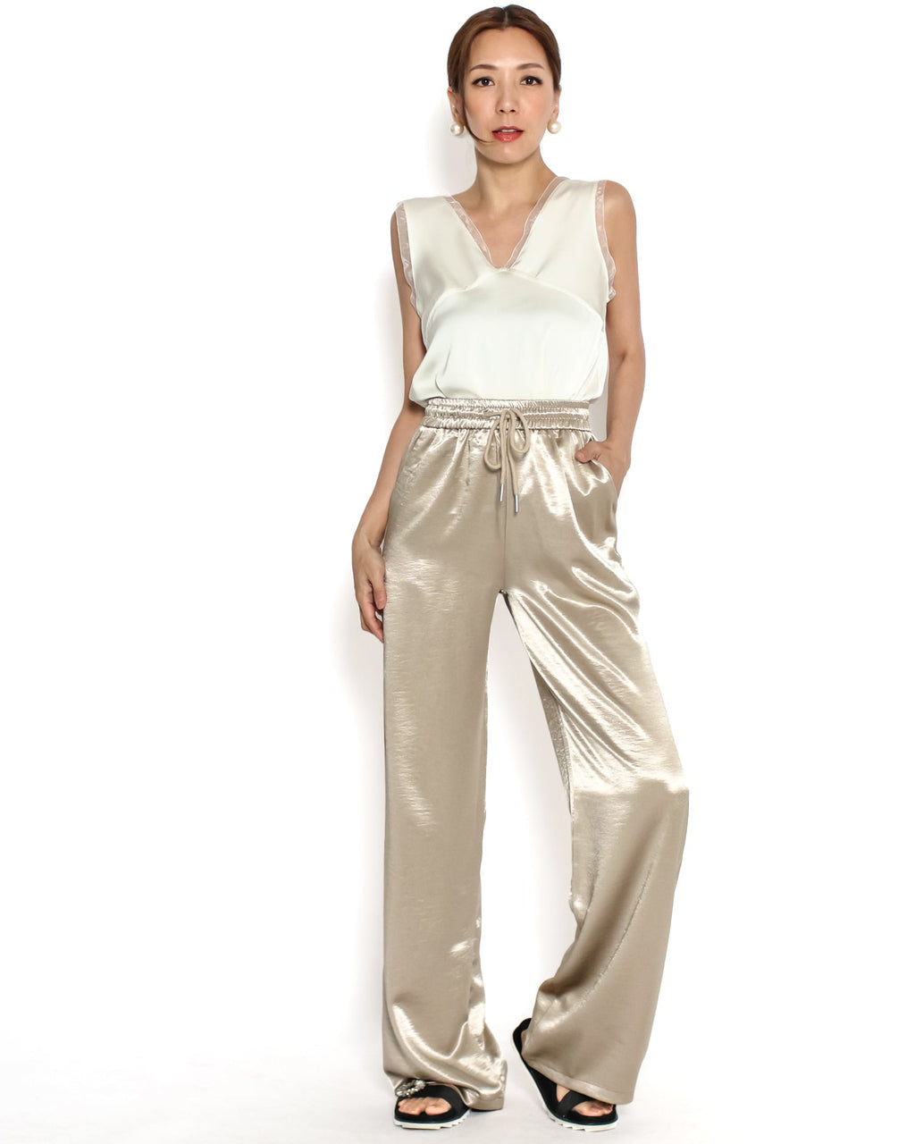 beige shiny straight leg pants