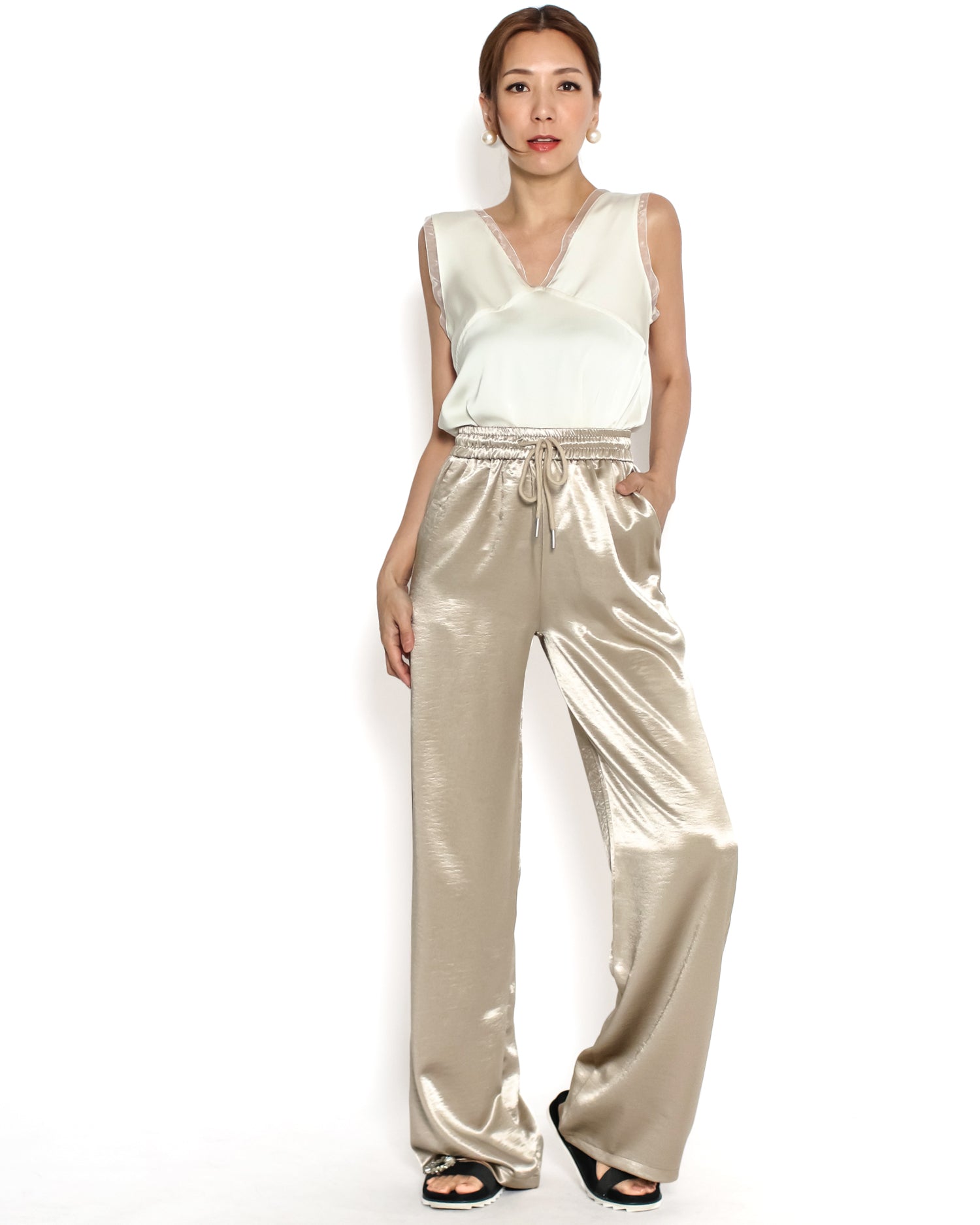 beige shiny straight leg pants
