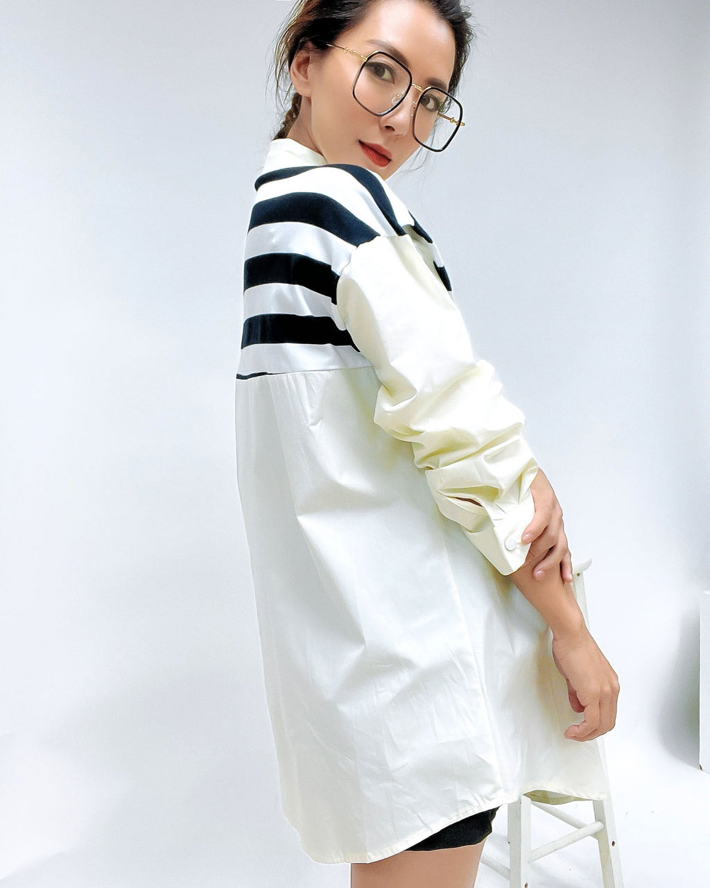 black frame with gold amrs clear lens glasses