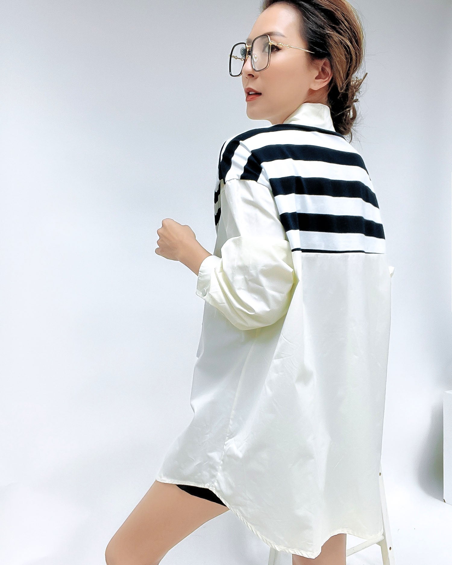 black frame with gold amrs clear lens glasses