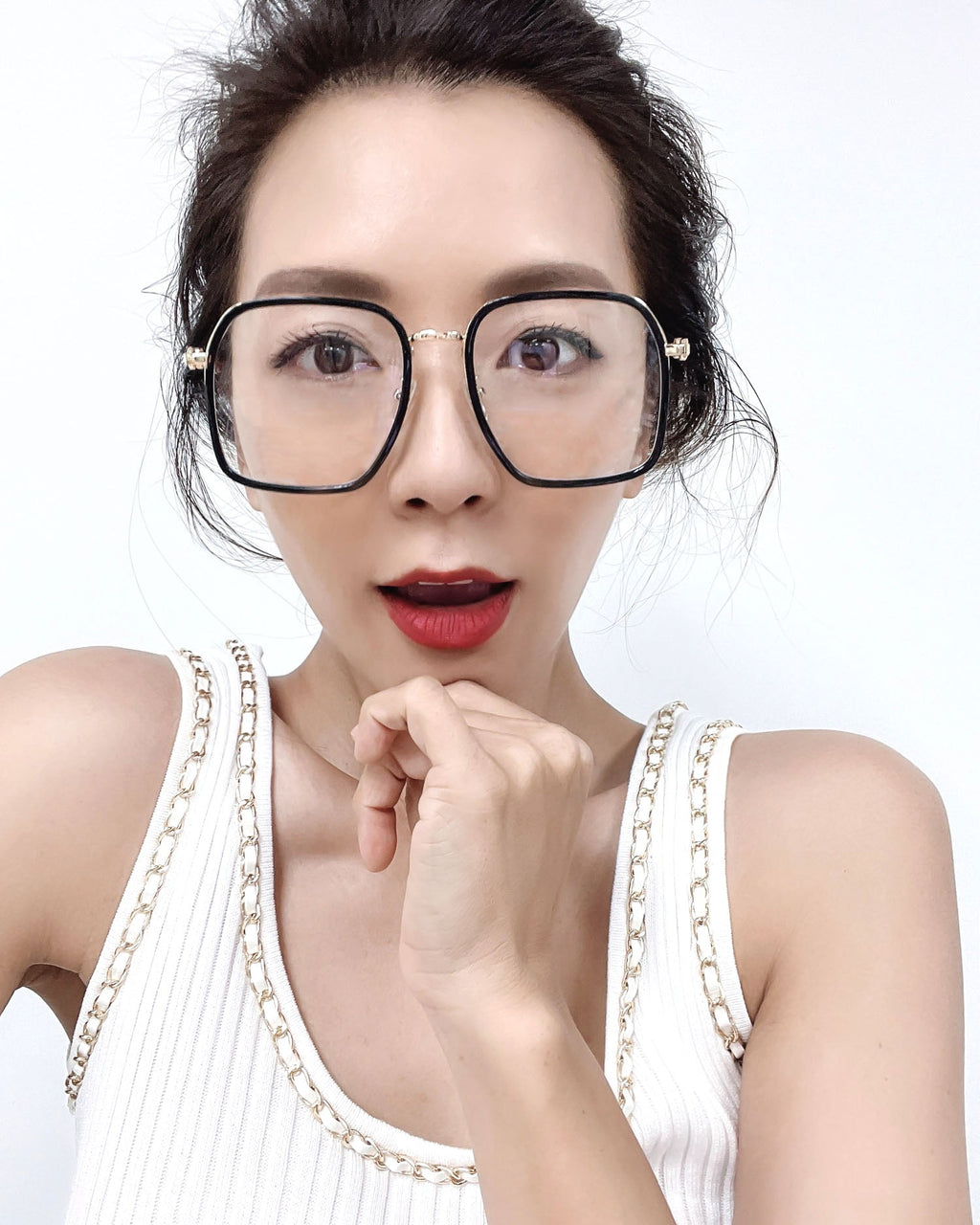 black frame with gold amrs clear lens glasses