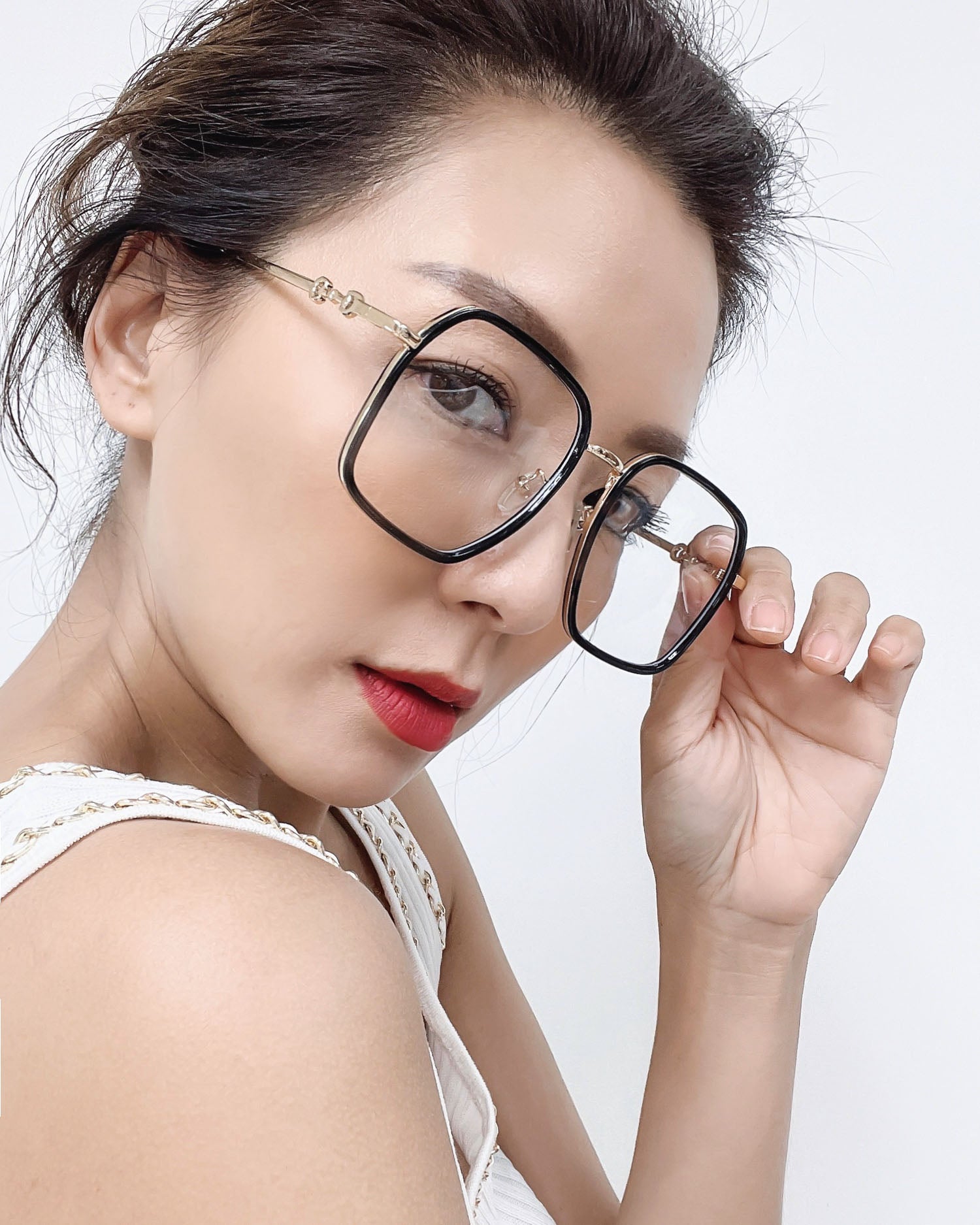 black frame with gold amrs clear lens glasses